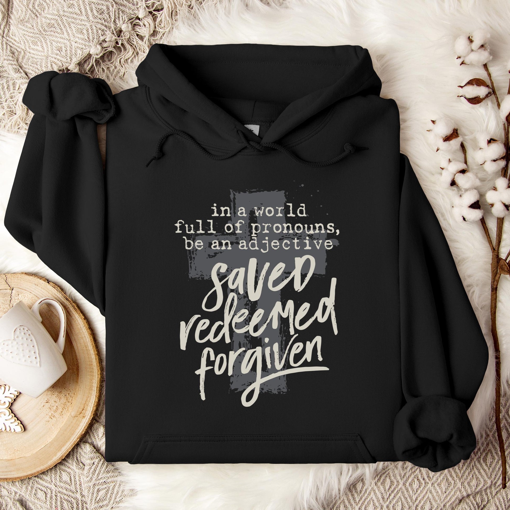 In A World Full Of Pronouns Be An Adjective Saved Redeemed Forgiven Hoodie