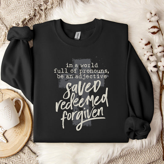 In A World Full Of Pronouns Be An Adjective Saved Redeemed Forgiven Sweatshirt