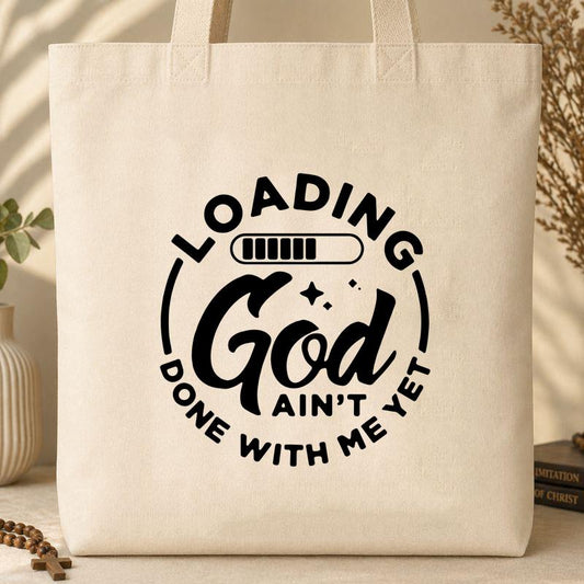 Loading God Ain_t Done With Me Yet Tote Bag